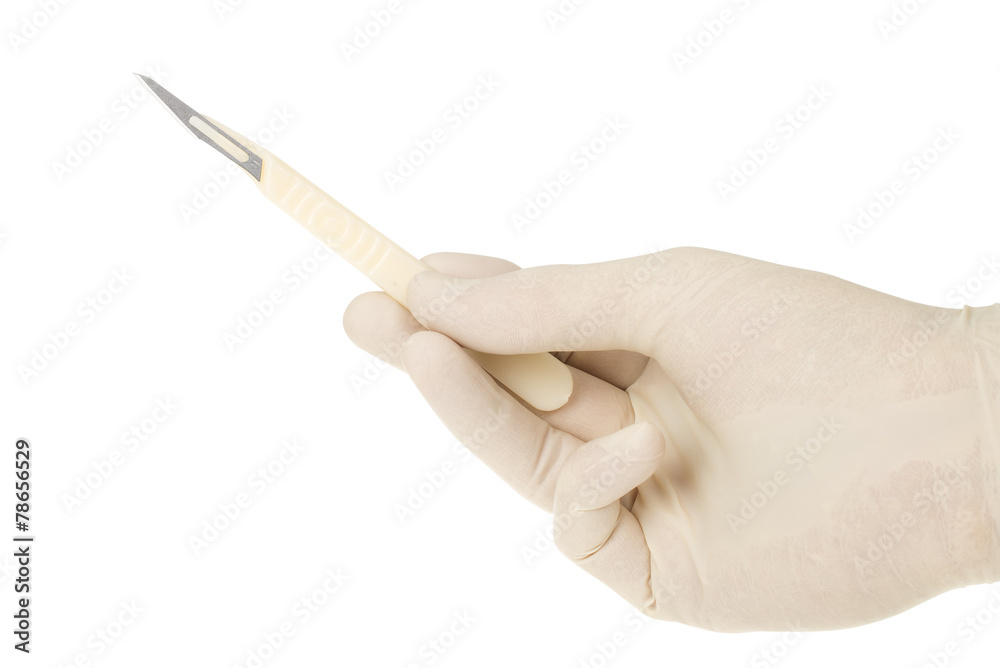 scalpel holded by doctor's hand on white background scalpel holded by doctor's hand on white background