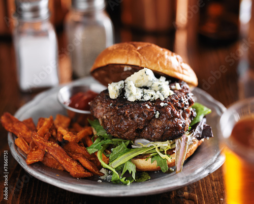 gourmet hamburger with blue cheese, sweet potato fries and beer  photo