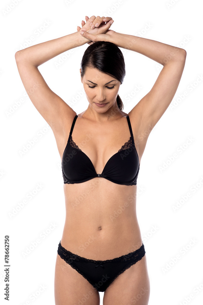 Naklejka premium Elegant woman posing in black lingerie