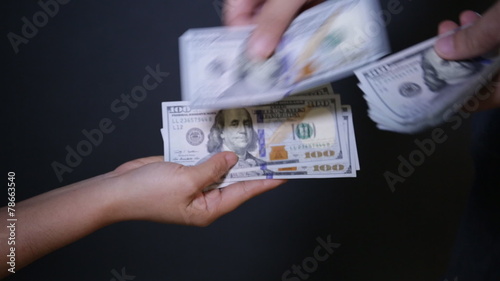 Close up of paying cash