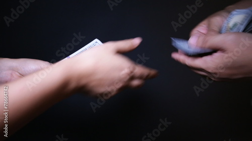 Close up of paying cash