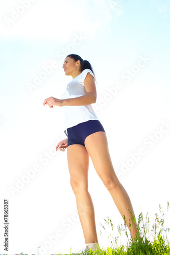 Young woman do sport on a play-ground