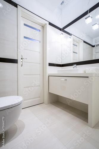 Toilet with washbasin in apartment