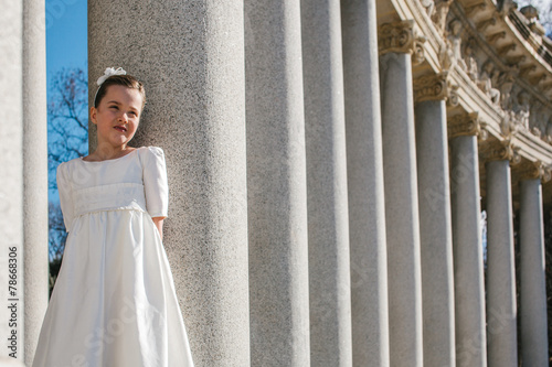 Cute Little Girl in Her First Communion Day