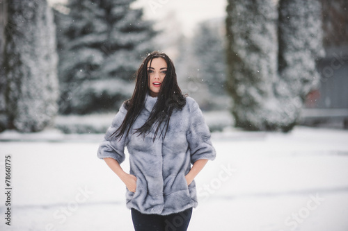winter portrait of Beauty girl with snow