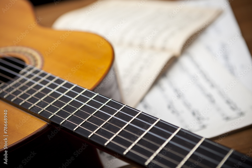 Obraz premium The concept of musical notes and guitar in the background
