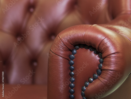Leather,buttons and decorative nails.