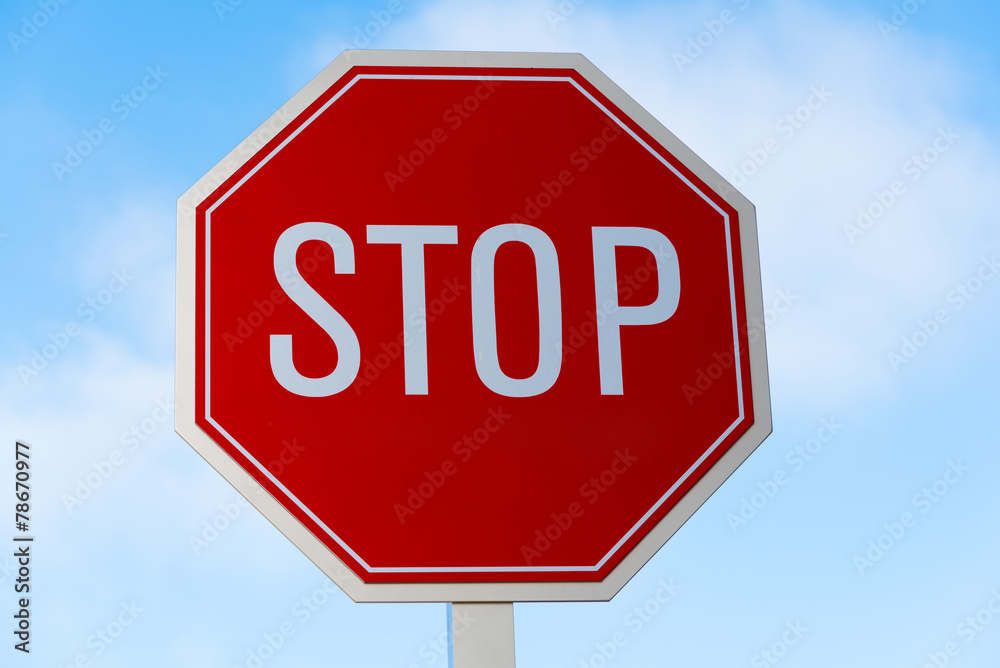 Stop sign in southern California with a sky blue background Stop sign in southern California with a sky blue background