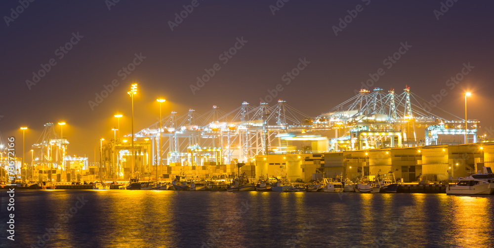 night  view of   cranes and containers in cargo seaport