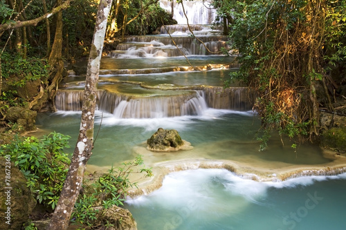 Waterfall blue in dense jungle