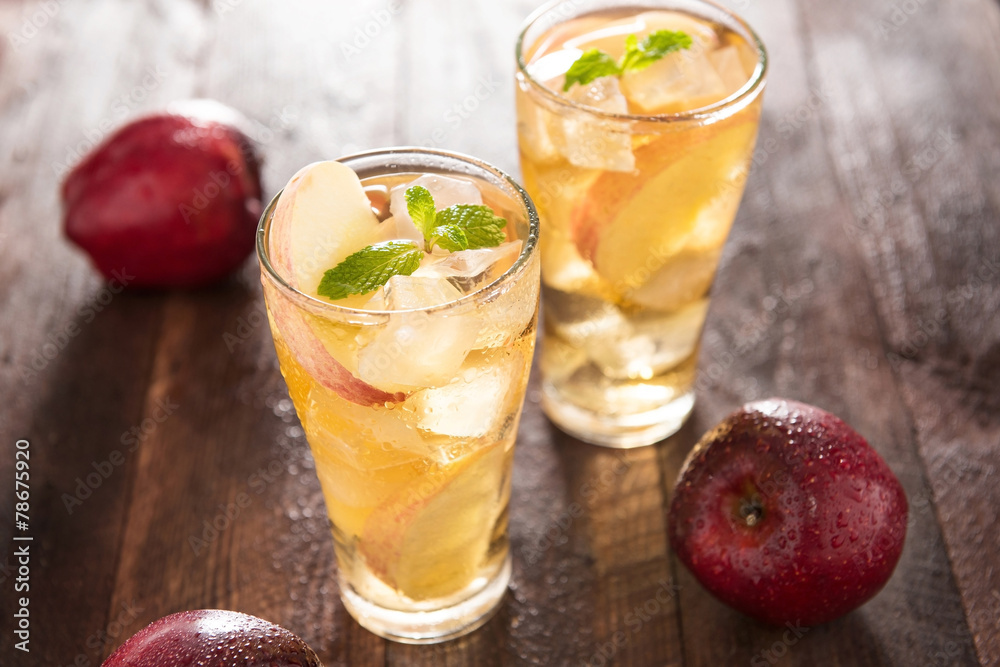 apple juice and apples on wooden table apple juice and apples on wooden table