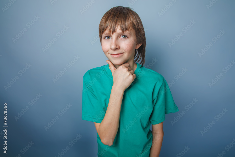 boy teenager European appearance brown hair in a turquoise t-shi boy teenager European appearance brown hair in a turquoise t-shi