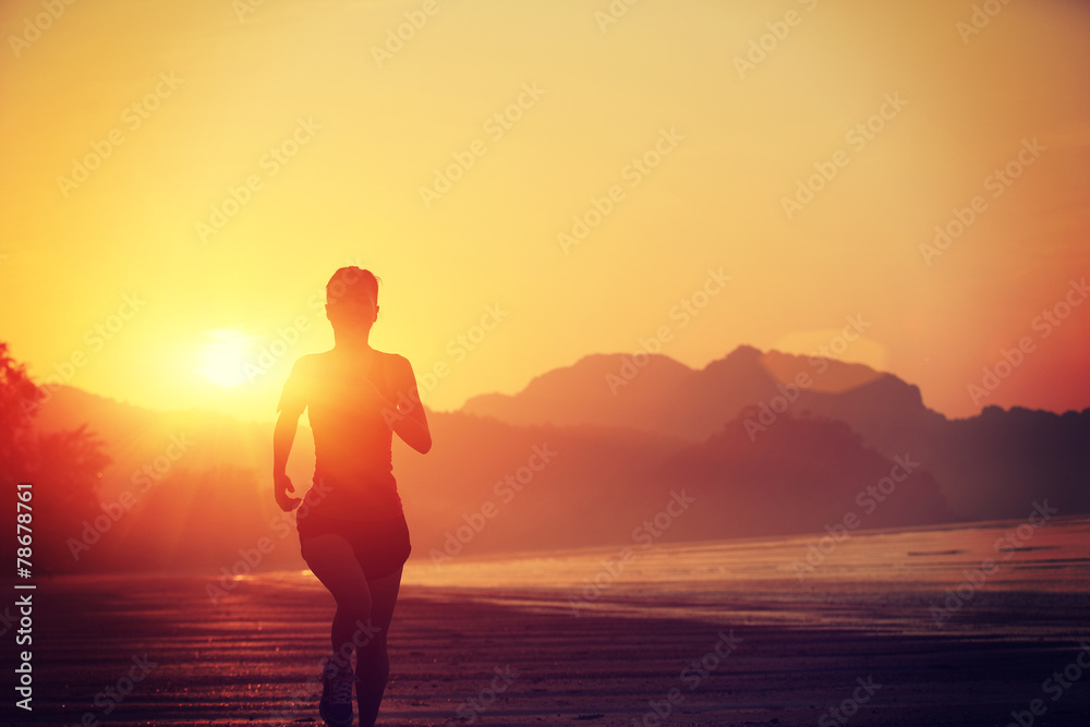 young woman running on sunrise beach young woman running on sunrise beach