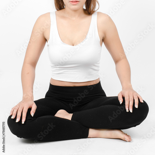 Portrait of pretty young woman doing yoga exercise