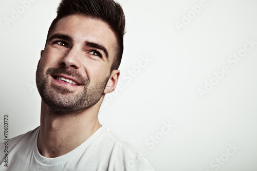 portrait of young smiling handsome man