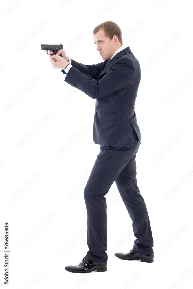 secret agent man in business suit posing with gun isolated on wh secret agent man in business suit posing with gun isolated on wh