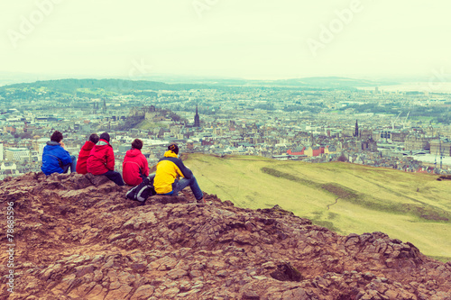 Family enjoying view of Edinburgh from top of Arthurs seat photo