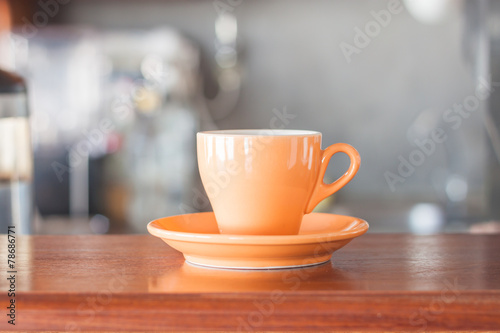 Oange coffee cup in coffee shop
