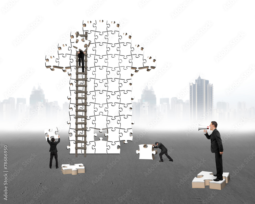 Businessman commanding workers to build arrow jigsaw puzzle with Businessman commanding workers to build arrow jigsaw puzzle with