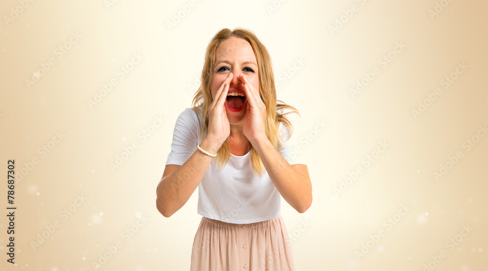Girl shouting over isolated white background Girl shouting over isolated white background