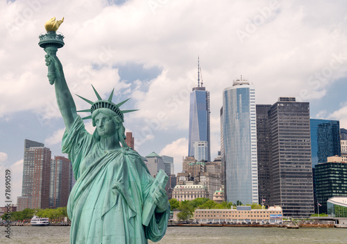 New York City tourism concept. Statue of Liberty with Lower Manh