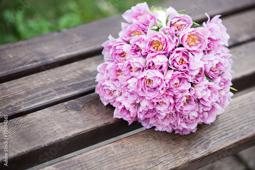 Beautiful wedding bouquet sitting on wooden planks © scata