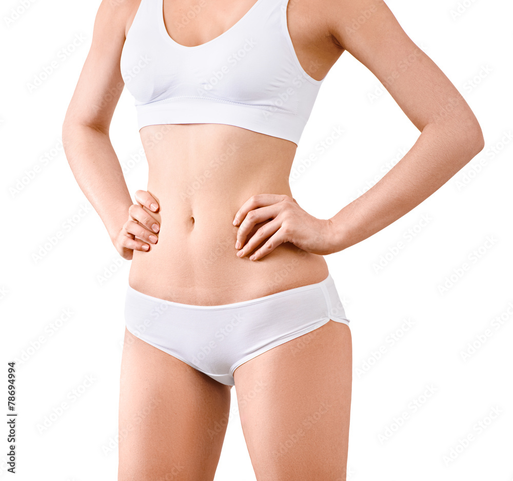 Woman with beautiful slim body posing in underwear on the white