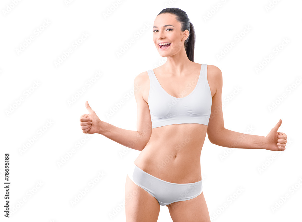 Woman with beautiful slim body posing in underwear on the white Woman with beautiful slim body posing in underwear on the white
