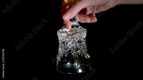crystal hand bell on a black background photo