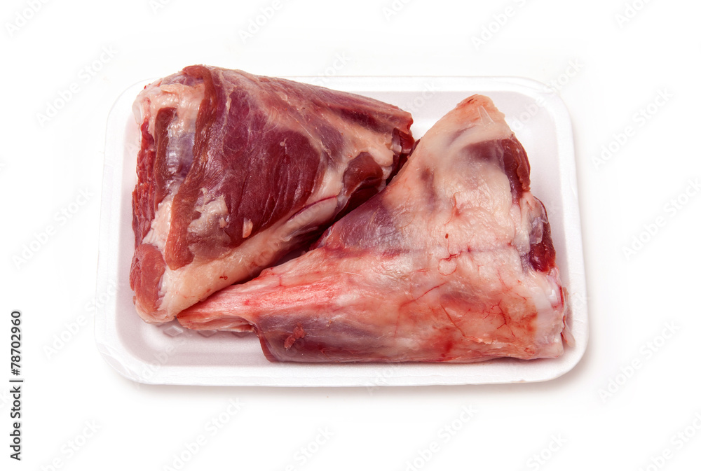 Goat meat shanks isolated on a white studio background.