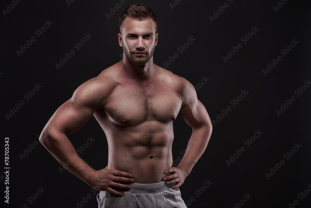 muscular man isolated on black background