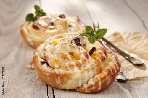 Sweet bun with raisins and cheese photo