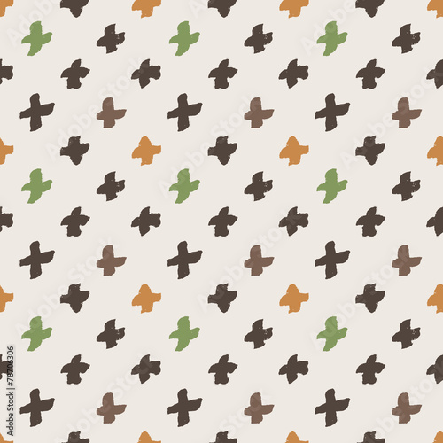 Seamless pattern of colorful hand-painted crosses