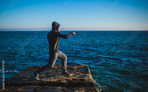karate training on the shores of the  sea
