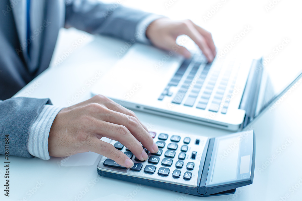 Closeup of businessman hands typing on laptop computer Closeup of businessman hands typing on laptop computer