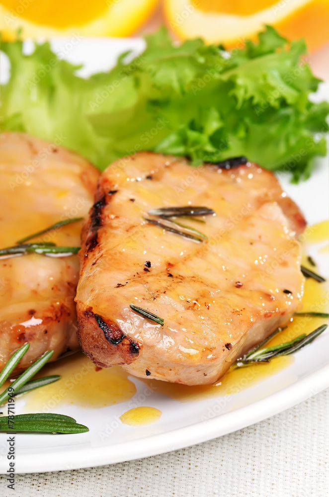 Grilled pork steak with orange sauce