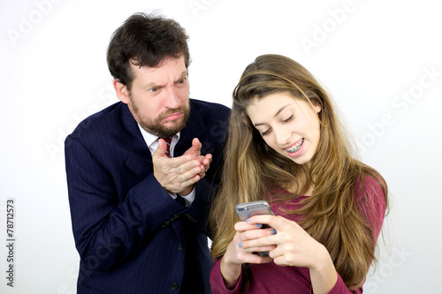 Father angry with daughter playing with smart phone
