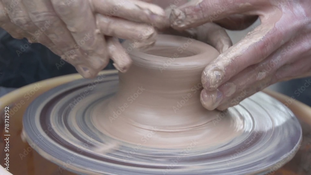 Clay pot on a potter's wheel Clay pot on a potter's wheel