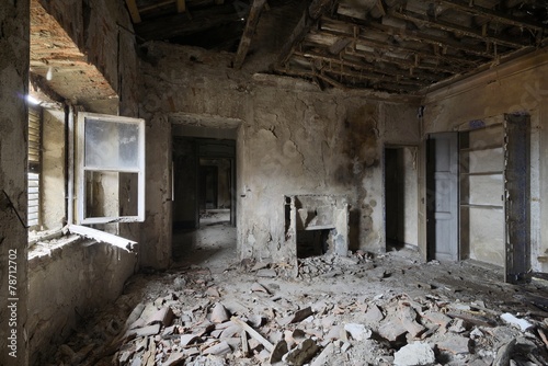 old abandoned room with window and fireplace