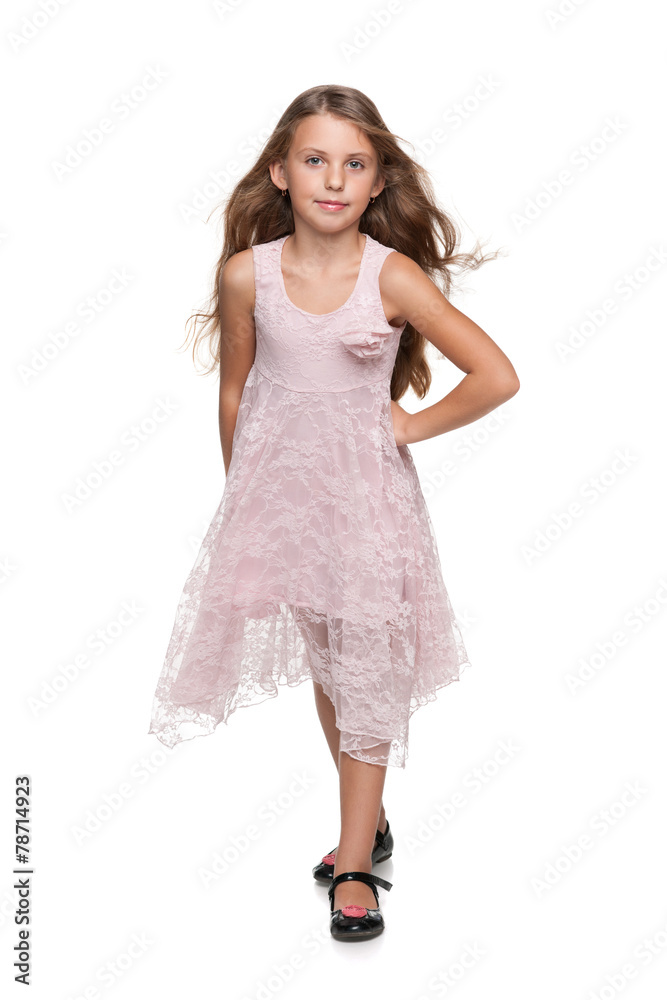 Naklejka premium Adorable young girl walks