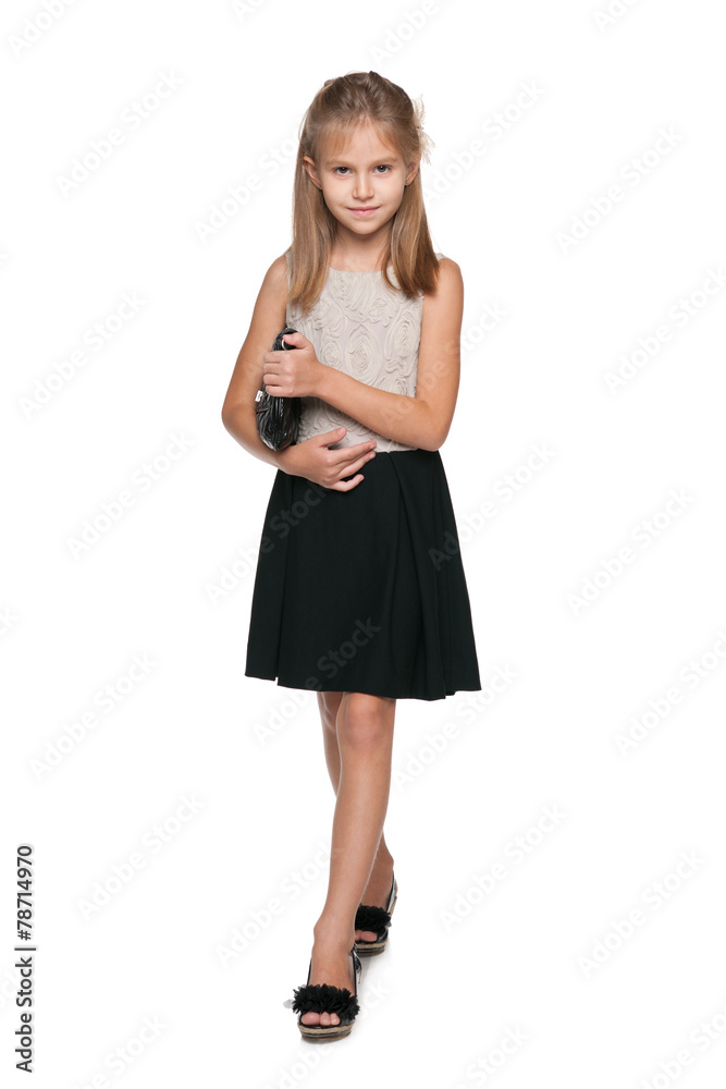 Smiling young girl with a handbag