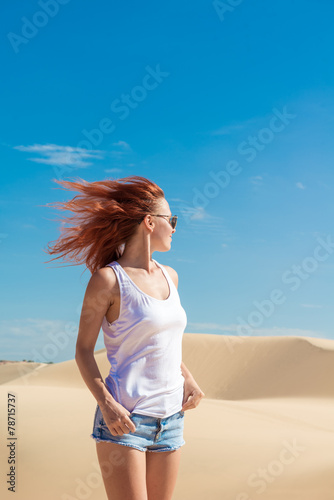 Beautiful woman in sand dunes