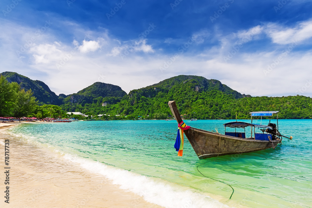 Long tail boat on tropical beach, Krabi, Thailand Long tail boat on tropical beach, Krabi, Thailand