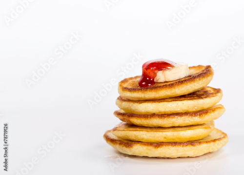 isolated stack of pancake with banana and jam