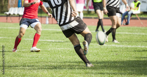 Fototapeta Naklejka Na Ścianę i Meble -  Rugby player kicking the ball