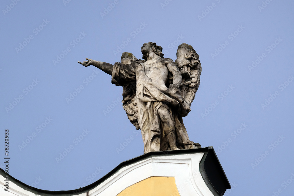 Angel on facade of Barmherzigenkirche in Graz, Austria 