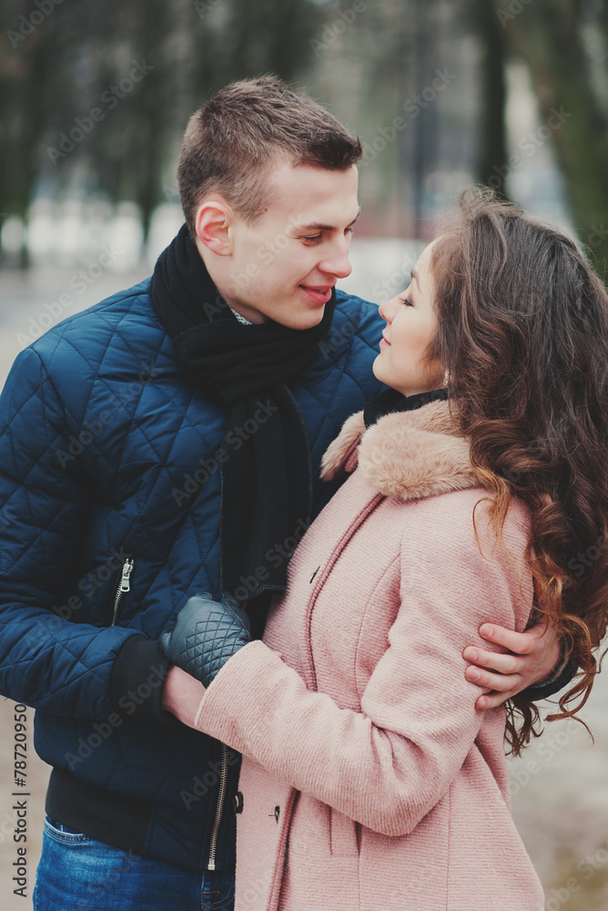 Happy young couple in love walking in the park Happy young couple in love walking in the park
