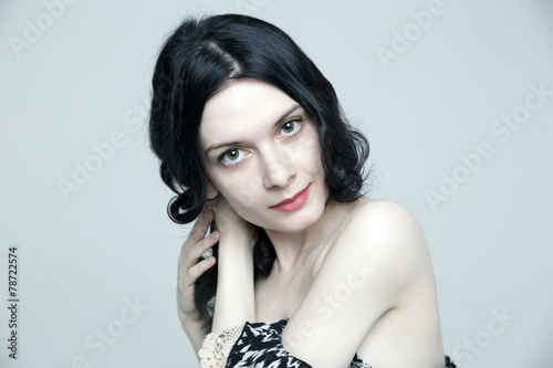 Glamorous young brunette woman with beautiful skin and natural