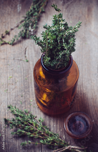 pharmacy bottle and thyme herb