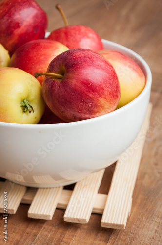 Red apples on wooden board
